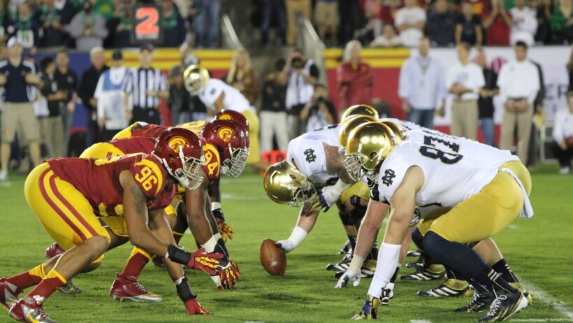 The Notre Dame Fighting Irish and the USC Trojans on the line of scrimmage
