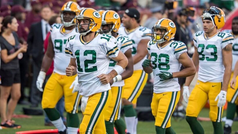 Aaron Rodgers taking the field.