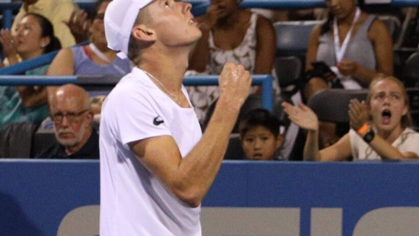 Alex de Minaur looking up thankful