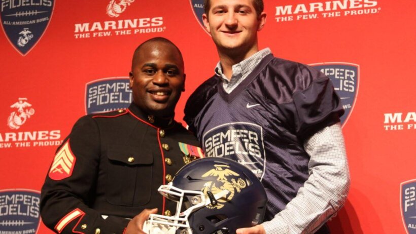 Austin Kendall receiving his Semper Fidelis All-American Bowl jersey in 2015.