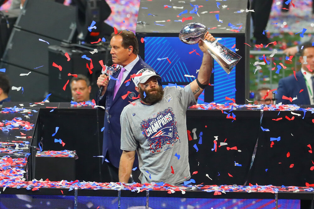 Julian Edelman Patriots WR holding up the Lombardi Trophy at Super Bowl 53