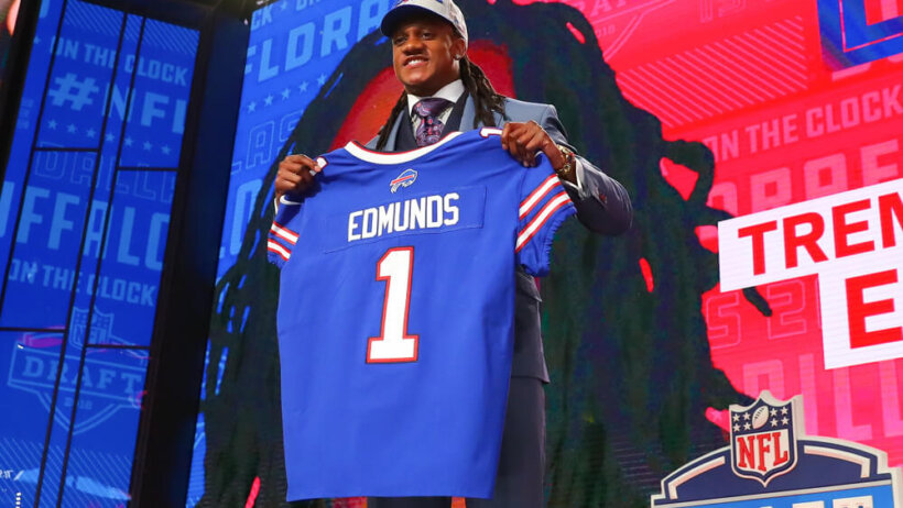 Tremaine Edmunds holds up a jersey and takes a photo after being chosen by the Buffalo Bills