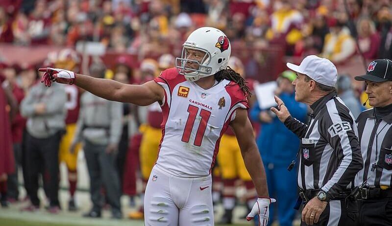 Cardinals WR Larry Fitzgerald talking to an official.