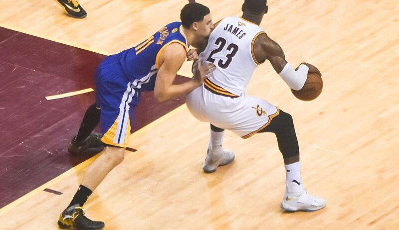 LeBron James backs down Klay Thompson