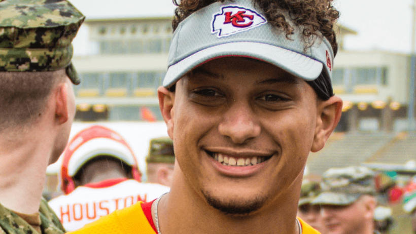 KC quarterback Patrick Mahomes smiling for the camera.
