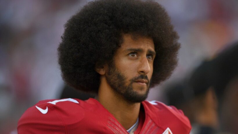 Colin Kaepernick standing on the sideline in San Francisco