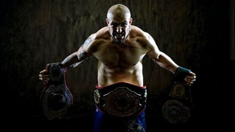JC Llamas flexing with his title belts