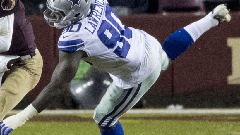 Cowboys edge rusher Demarcus Lawrence lunging after Washington QB Kirk Cousins.