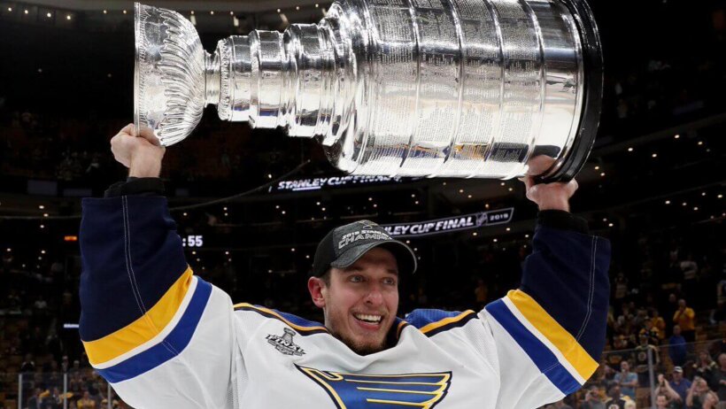 Jordan Binnington holding Stanley Cup