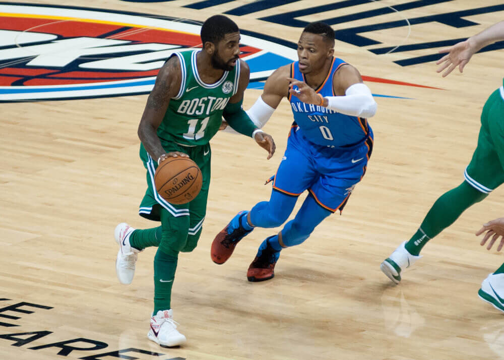 Kyrie Irving dribbles basketball