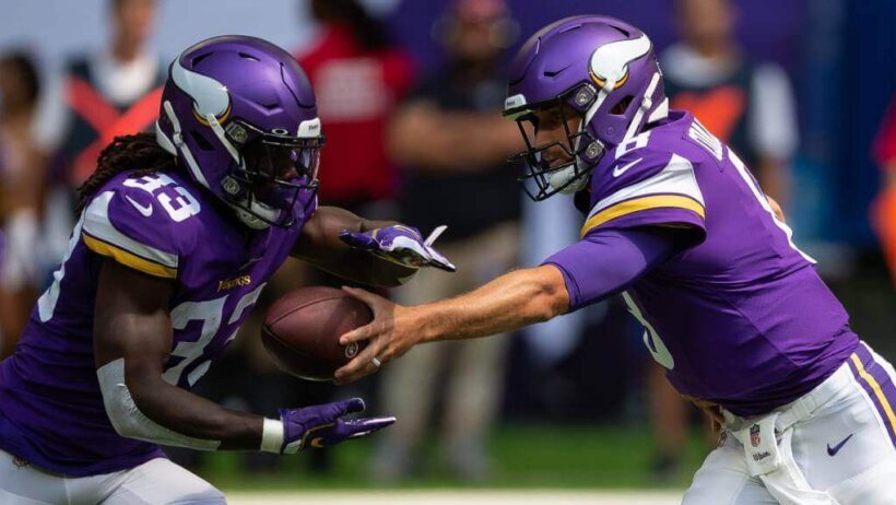 Dalvin Cook takes a handoff from Kirk Cousins