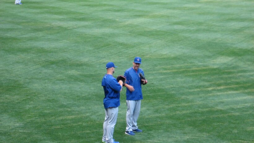 David Ross and Mike Borzell talking in the outfield