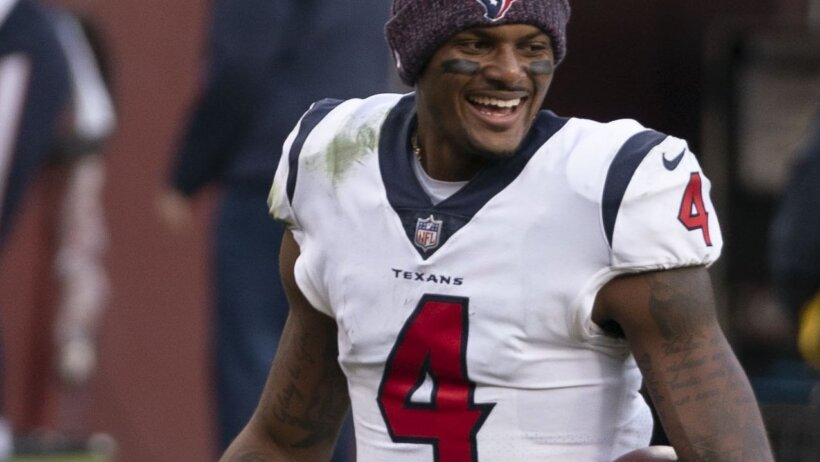 Deshaun Watson smiling on the field post game