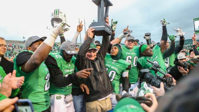 Marshall head coach Doc Holliday celebrates a bowl victory