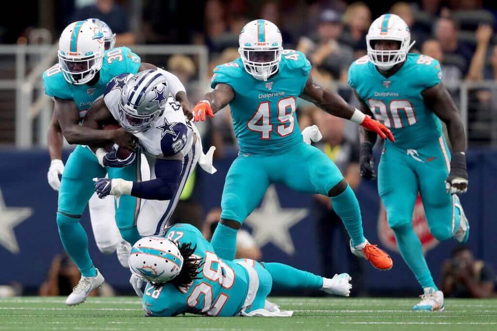 Miami Dolphins players on the field
