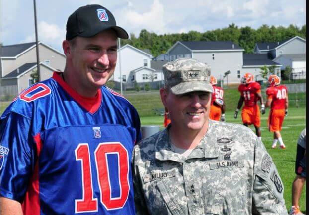Doug Marrone having his picture taken with the troops