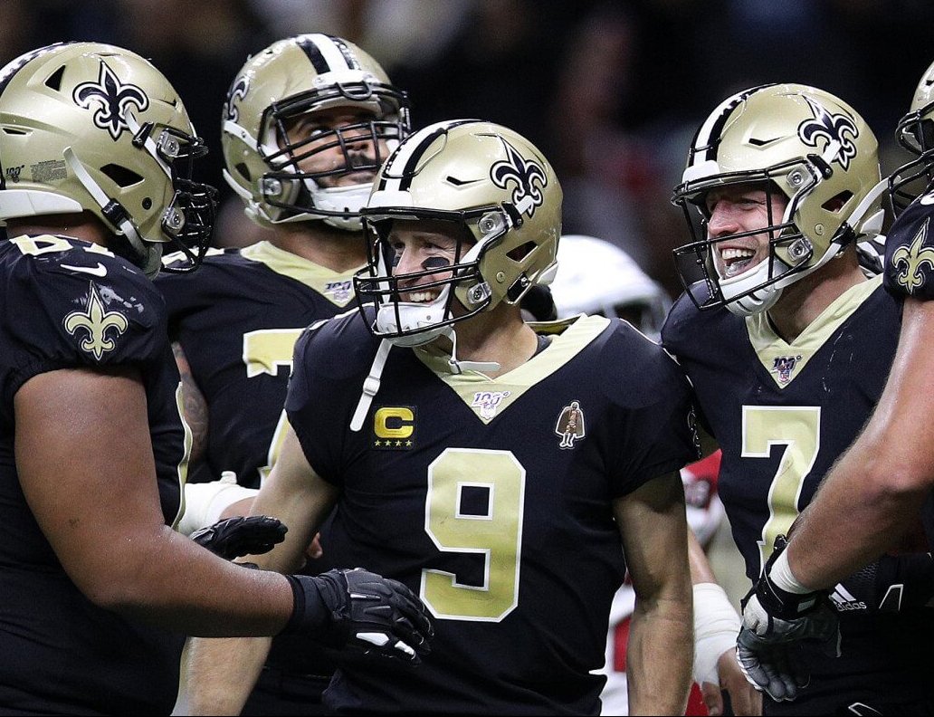 Drew Brees celebrates with Saints teammates