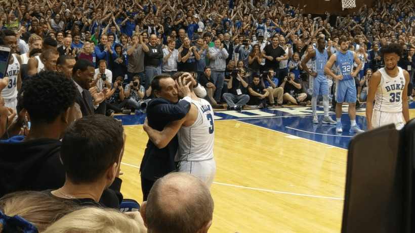 Duke coach Mike Krzyzewski hugging guard Grayson Allen