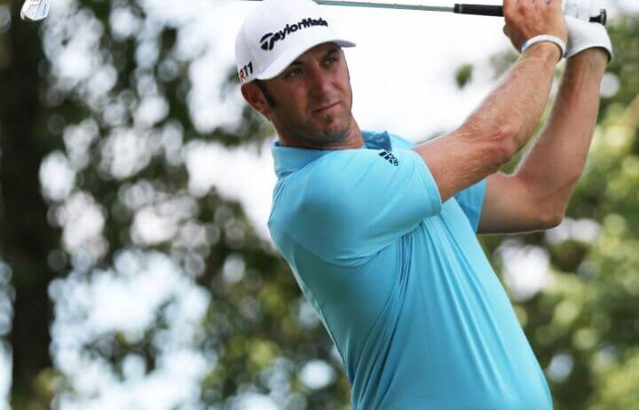 Dustin Johnson follows through on an iron shot.