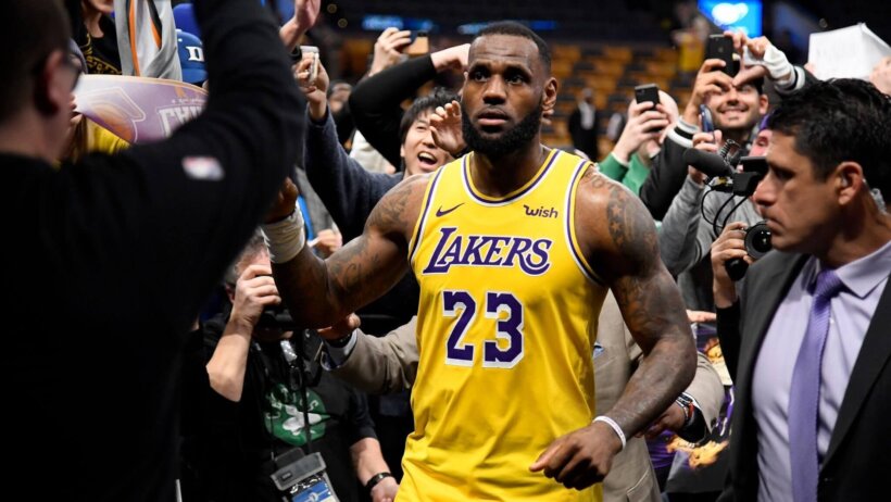 LeBron James high fives with fans