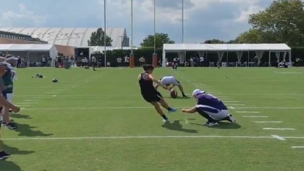 Carli Lloyd kicking field goal.