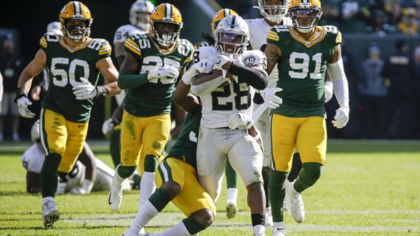 Josh Jacobs breaking tackles