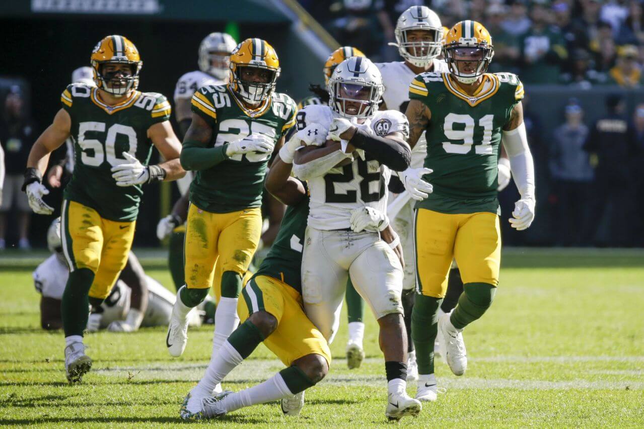Josh Jacobs breaking tackles