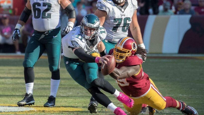 Philadelphia Eagles QB Carson Wentz getting tackled.