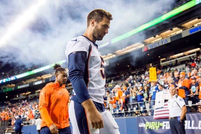 Joe Flacco Denver Broncos walking off the field