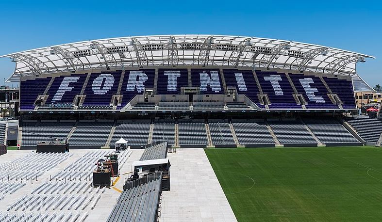 The word "Fortnite" spelled out in the bleachers of a soccer stadium.
