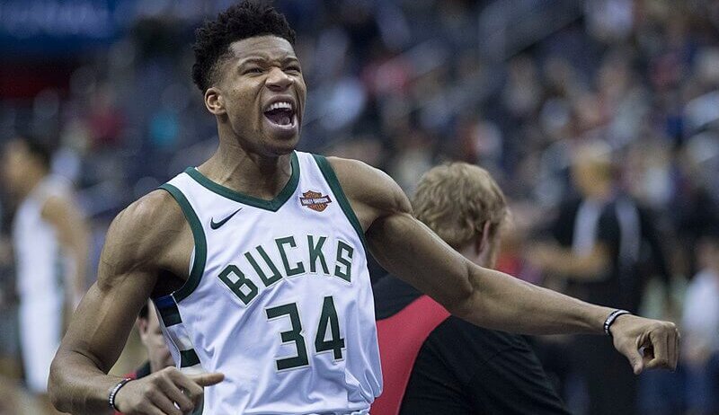 Giannis Antetokounmpo celebrating on the court