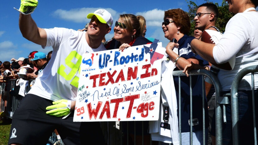 JJ Watt of the Houston Texans taking pictures with fans