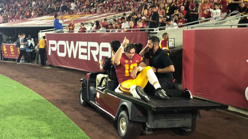 USC starting quarterback JT Daniels is cartered off the field against Fresno State