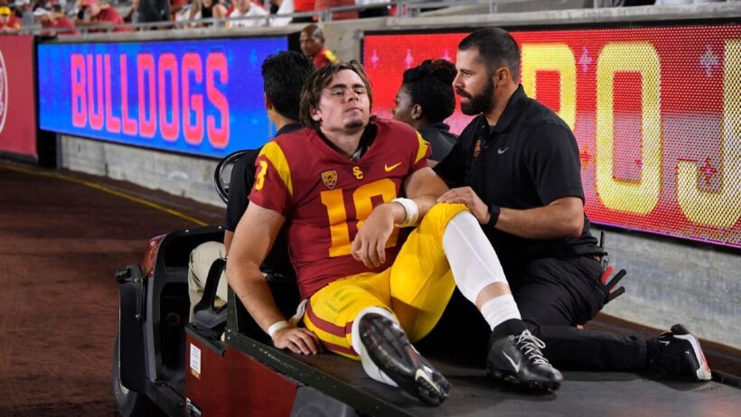 USC quarterback JT Daniels is carted off the field