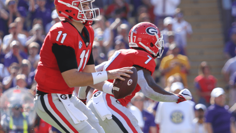 Jake Fromm taking a snap out of shotgun