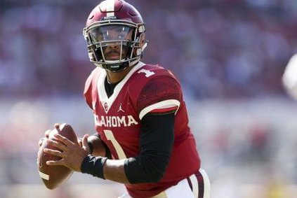 Jalen Hurts preparing to throw a pass