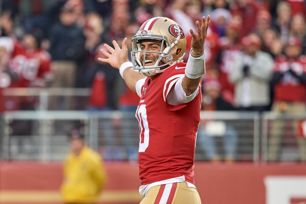 Jimmy Garoppolo of the 49ers with his hands in the air