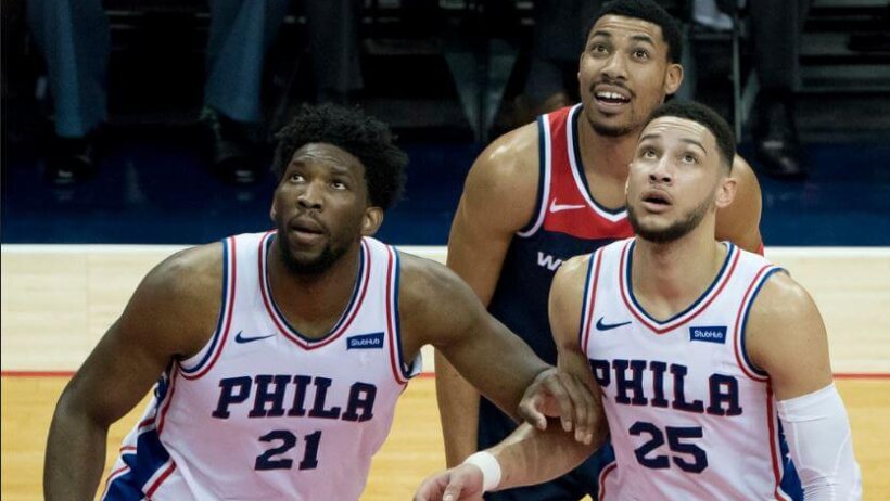 Joel Embiid and Ben Simmons waiting to grab a rebound