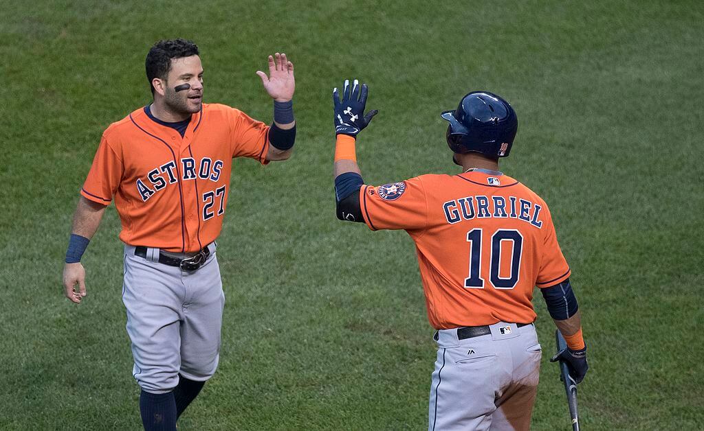 Jose Altuve high-fiving Yuli Gurriel