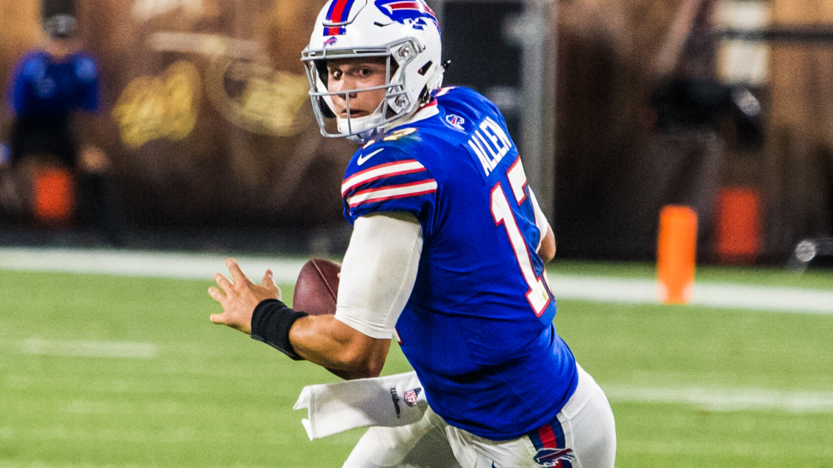 Josh Allen rolling out to pass