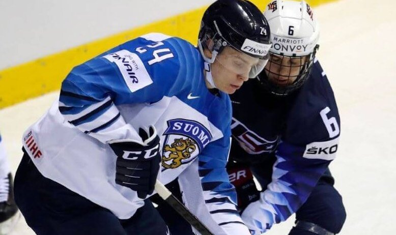 Kappo Kakko and Jack Hughes battling for the puck at the 2019 IIHF World Championships.