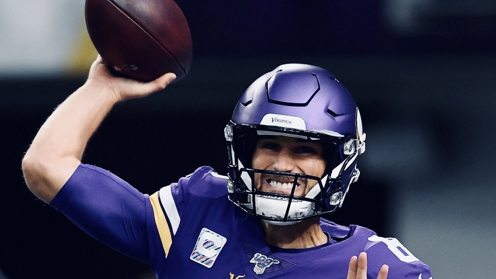 Kirk Cousins throwing a pass