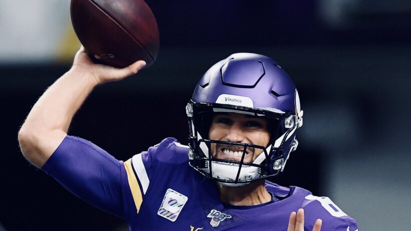 Kirk Cousins throwing a pass