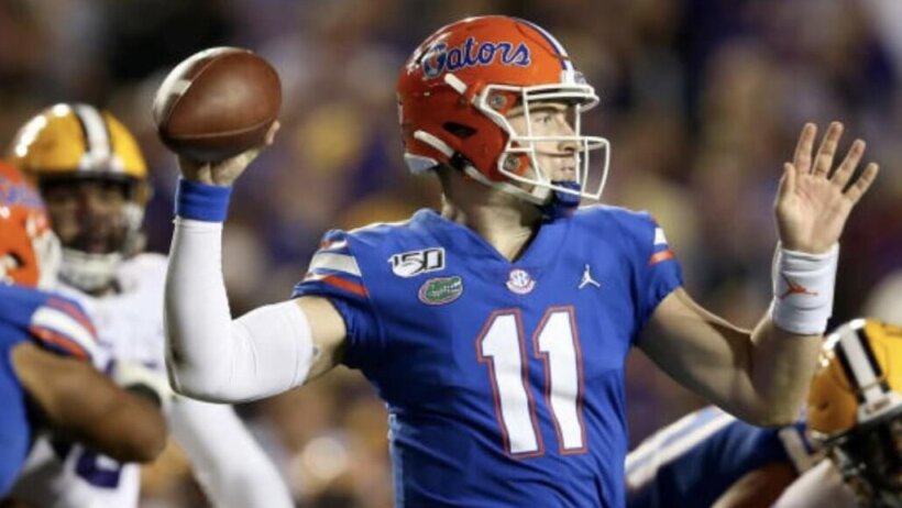 Kyle Trask throwing a pass
