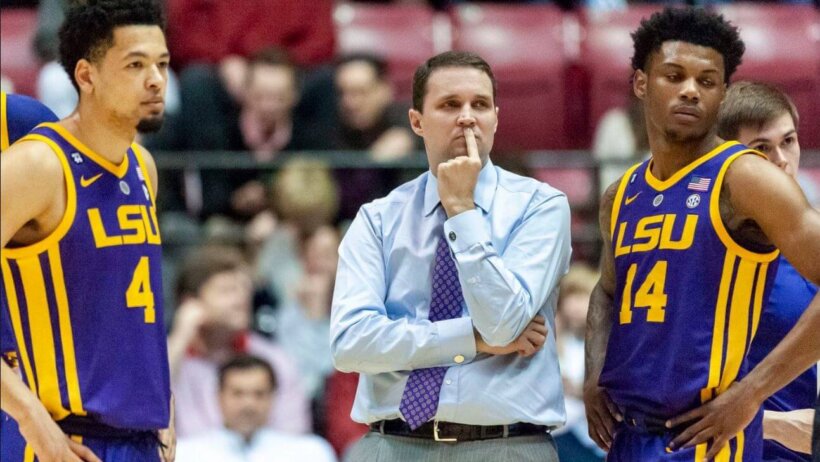 LSU basketball players Skylar Mays and Marlon Taylor standing with suspended head coach Will Wade.