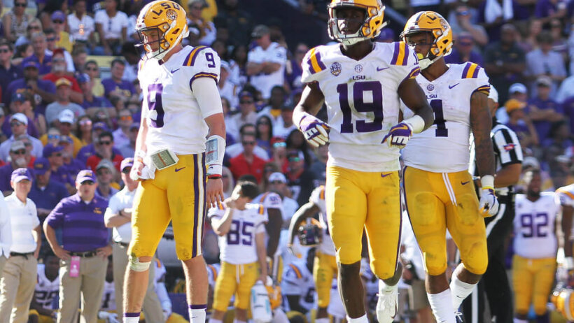 LSU quarterback Joe Burrow with wide receiver Derrick Dillon and running back Nick Brossette