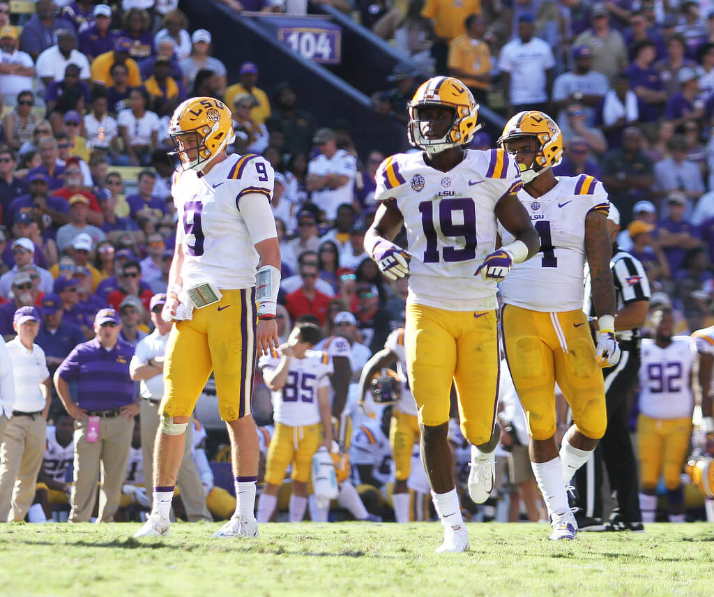 LSU quarterback Joe Burrow with wide receiver Derrick Dillon and running back Nick Brossette