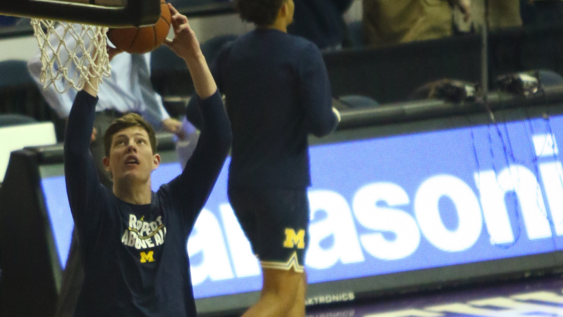 Michigan center John Teske warming up