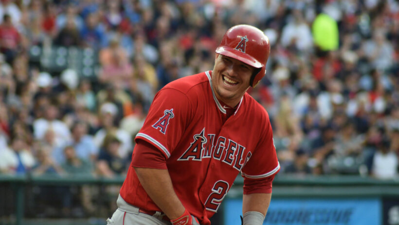 Mike Trout laughing on the base path.