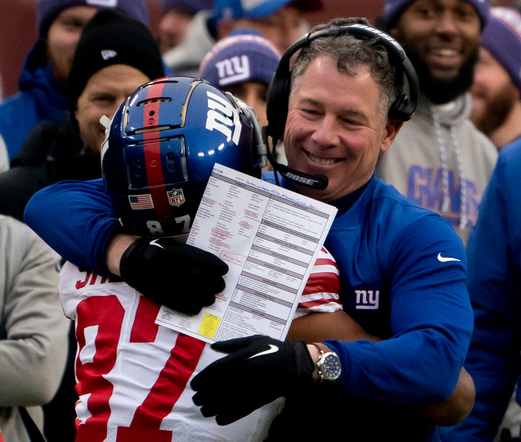 NY Giants head coach Pat Shurmur hugging Sterling Shepard.
